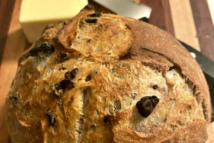 Round loaf of bread studded with olives 